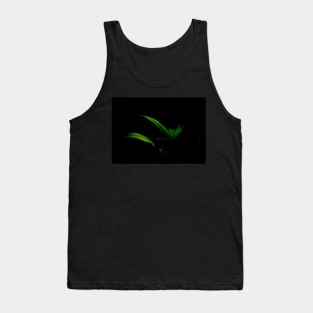 Bright green palm frond caught in sun against black background Tank Top